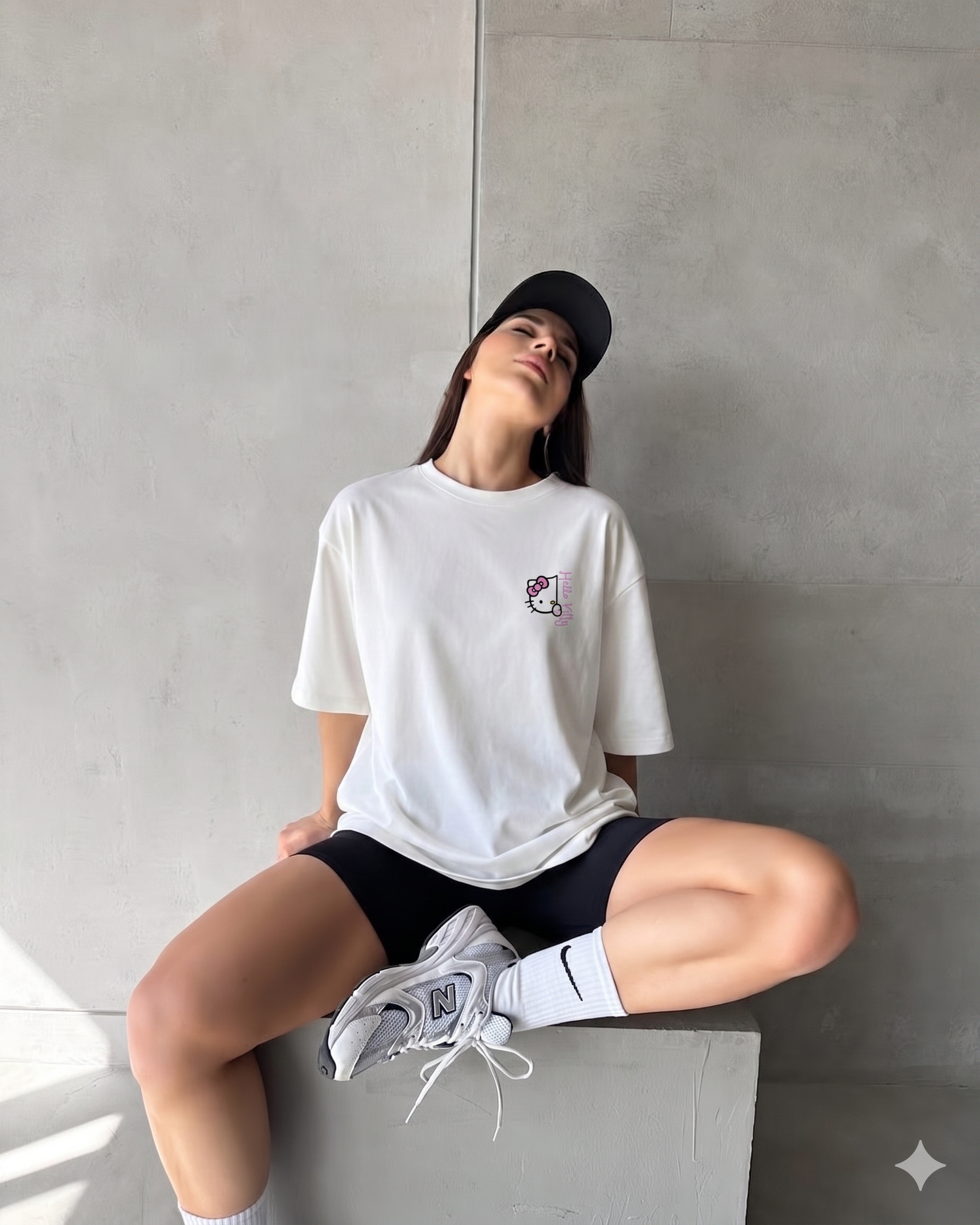 Girl wearing oversized Sweet Vibes Hello Kitty t-shirt by Navalook