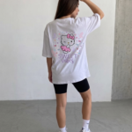 Girl wearing oversized Sweet Vibes Hello Kitty t-shirt by Navalook