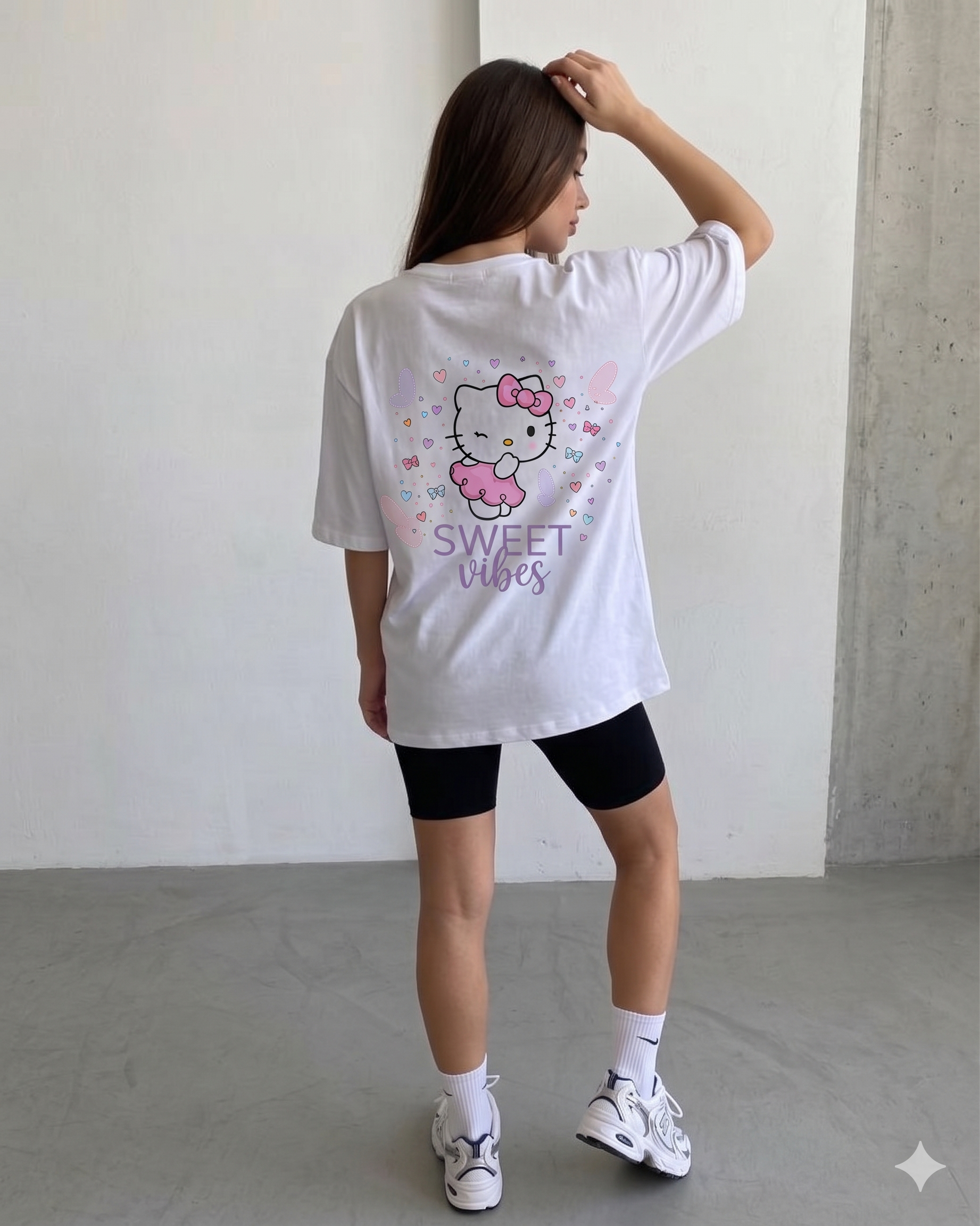 Girl wearing oversized Sweet Vibes Hello Kitty t-shirt by Navalook