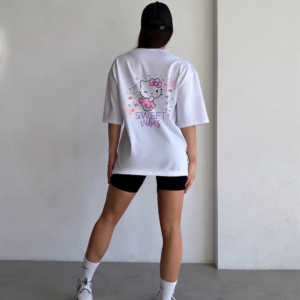 Girl wearing oversized Sweet Vibes Hello Kitty t-shirt by Navalook