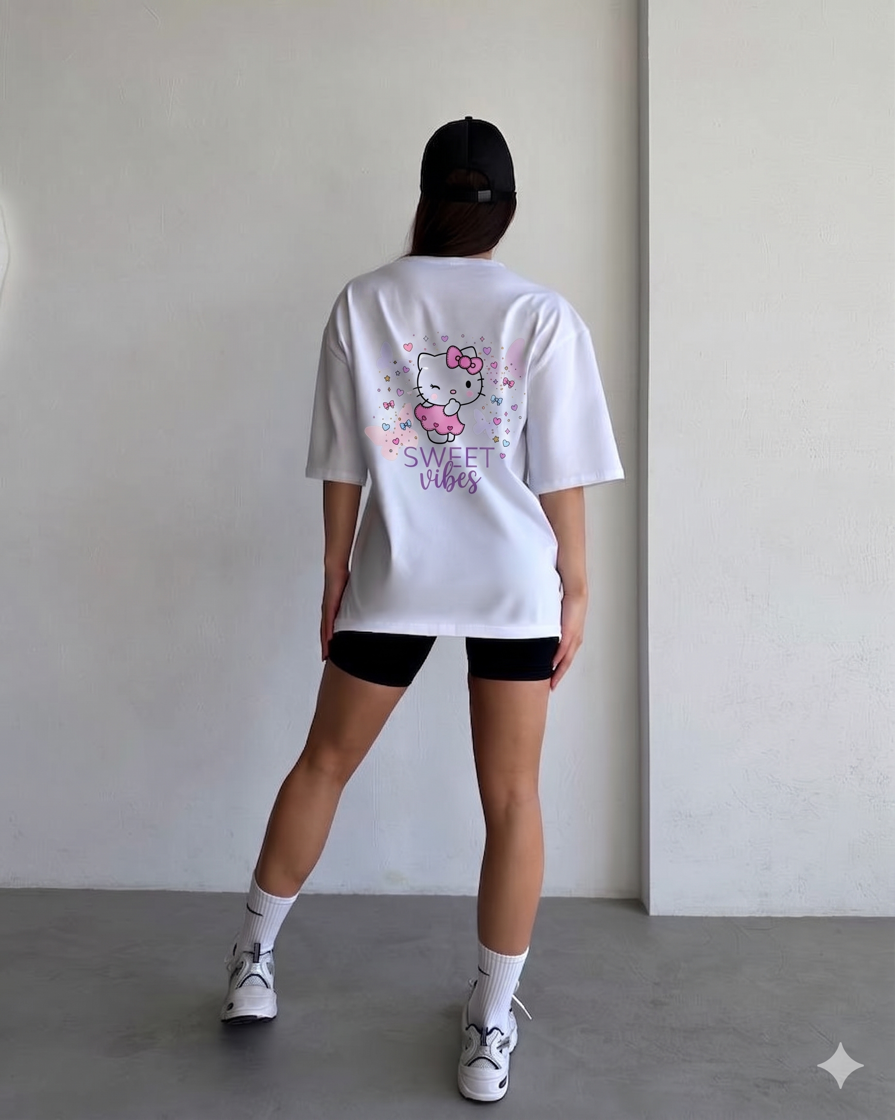 Girl wearing oversized Sweet Vibes Hello Kitty t-shirt by Navalook